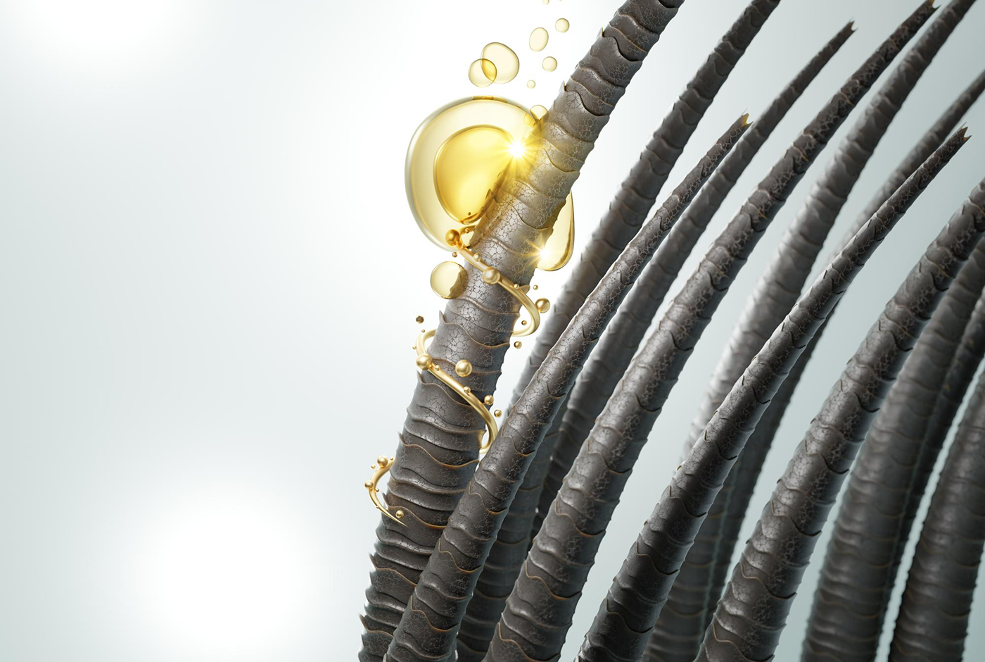 Close-up of dark hair strands with golden oil droplets illustrating hair care science